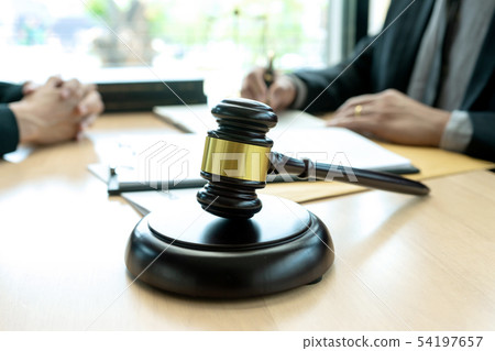 Judge or lawyer talking with team Judge or lawyer talking with team 54197657