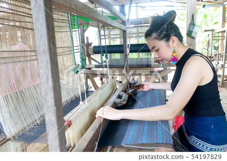 young woman weaving in old style thai 54197829