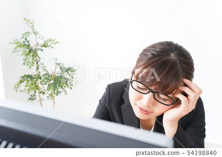 Business woman suffering from overwork, long working hours, overtime work 54198840