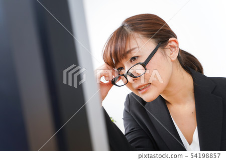 Business woman suffering from overwork, long working hours, overtime work 54198857