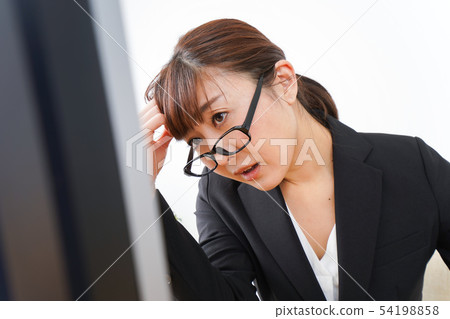 Business woman suffering from overwork, long working hours, overtime work Business woman suffering from overwork, long working hours, overtime work 54198858