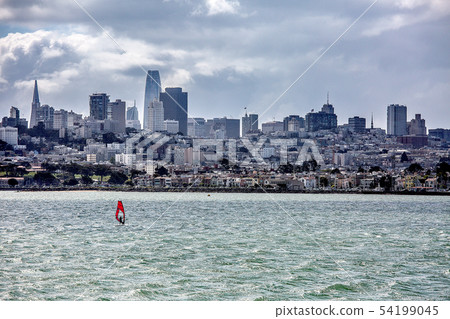 San Francisco cityscape and red yacht seen from the sea 54199045