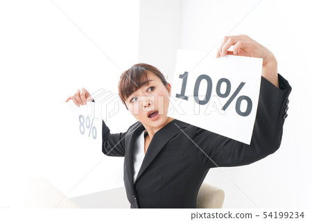 Young Business Woman Responding to Consumption Tax Increase Young Business Woman Responding to Consumption Tax Increase 54199234