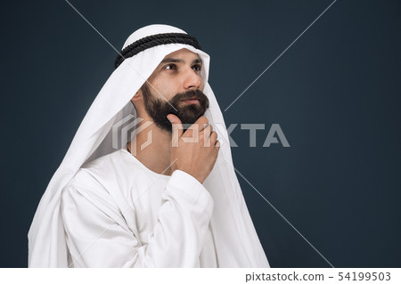 Arabian saudi businessman on dark blue studio background 54199503
