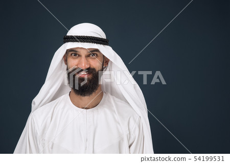 Arabian saudi businessman on dark blue studio background 54199531