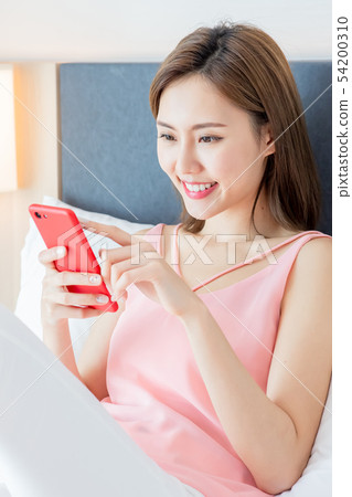 Asian woman use smartphone happily Asian woman use smartphone happily 54200310