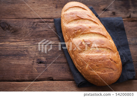 Fresh bread on wooden table. Fresh bread on wooden table. 54200803