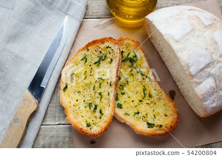 Fried bread with olive oil, garlic and herbs. Fried bread with olive oil, garlic and herbs. 54200804