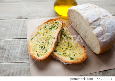 Fried bread with olive oil, garlic and herbs. Fried bread with olive oil, garlic and herbs. 54200805