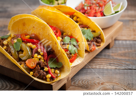 Mexican tacos with marbled beef and vegetables. Mexican tacos with marbled beef and vegetables. 54200857