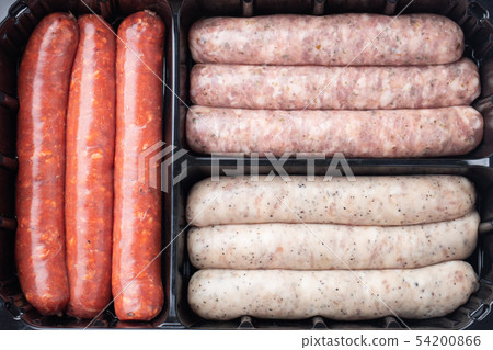 Assorted fresh raw sausages. 54200866