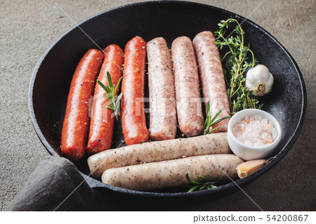 Assorted fresh raw sausages. 54200867