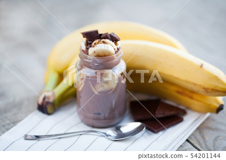 Chocolate pudding with banana. Chocolate pudding with banana. 54201144