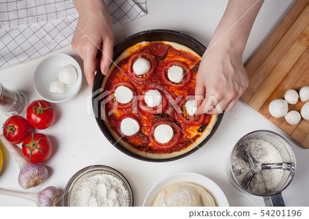 Cook prepares homemade pizza. Cook prepares homemade pizza. 54201196