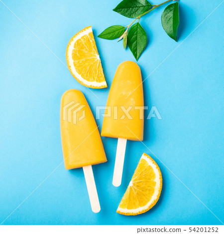 Orange popsicles with juice. 54201252