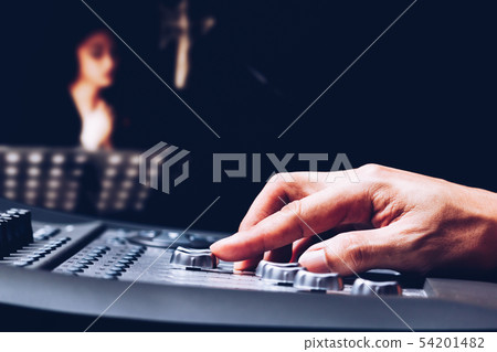 producer recording female voice in sound studio 54201482