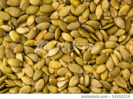 Pumpkin seeds background. The view of the top. 54202219