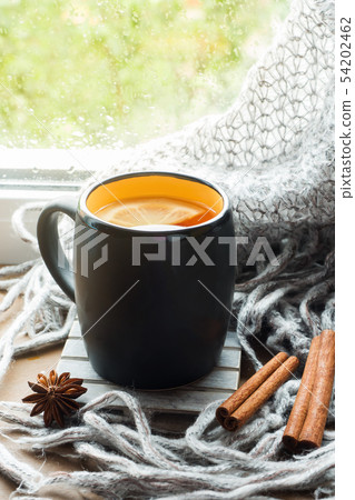 Cup hot tea with lemon on the windowsill Woolen Cup hot tea with lemon on the windowsill Woolen 54202462