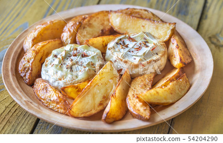 Baked Camembert cheese with potato Baked Camembert cheese with potato 54204290