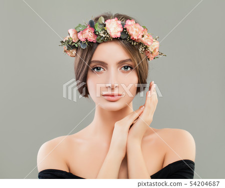 Beautiful woman wearing flowers wreath portrait Beautiful woman wearing flowers wreath portrait 54204687