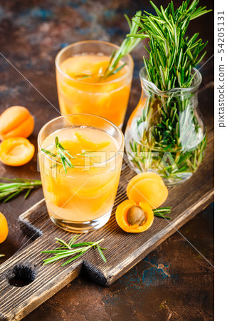 Summer drinks, rosemary aprcot cocktails. Summer drinks, rosemary aprcot cocktails. 54205131
