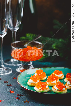 Delicious appetizer with red caviar. Delicious appetizer with red caviar. 54205158