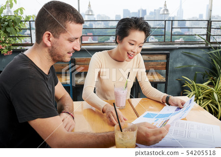 Business colleagues working over project Business colleagues working over project 54205518