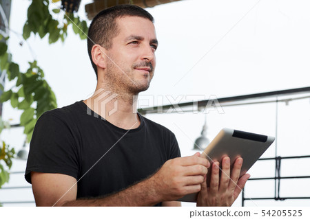 Young man with tablet pc Young man with tablet pc 54205525