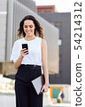 Businesswoman working with her smart phone and 54214312