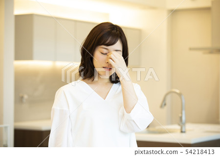 A middle-aged woman in poor health A middle-aged woman in poor health 54218413