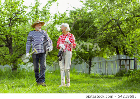 Pensioners ready for planting trees in their garden Pensioners ready for planting trees in their garden 54219683
