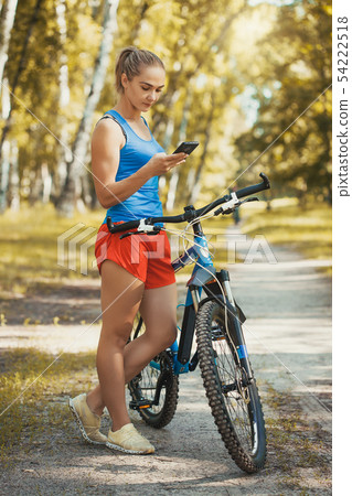 cyclist cycling mountain bike on birch forest trail cyclist cycling mountain bike on birch forest trail 54222518