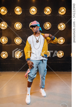 Black rapper in cap, perfomance on stage Black rapper in cap, perfomance on stage 54222940