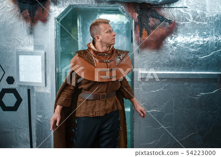 Space traveler looks out of the teleport, shuttle Space traveler looks out of the teleport, shuttle 54223000