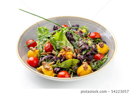 Vegan salad with nuts, apricot salads and greens. Vegan salad with nuts, apricot salads and greens. 54223057