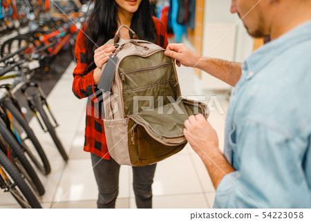 Couple choosing tourist equipment for travelling 54223058