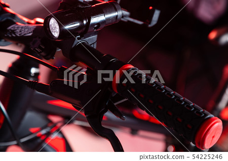 Closeup picture of a bicycle handlebar and breaks 54225246