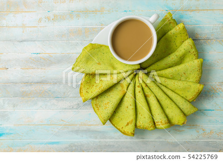 Matcha green tea with matcha green crepes 54225769