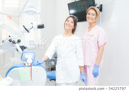 Two young women dentists in the treatment room. 54225797