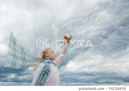 Traveling and freedom concept girl and airplane Traveling and freedom concept girl and airplane 54226430