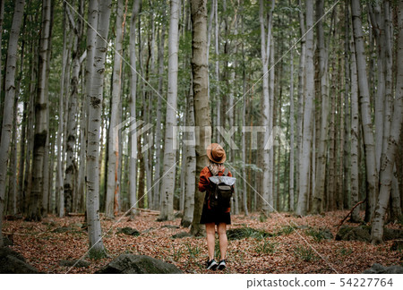 Style girl in hat with backpack in a summer time Style girl in hat with backpack in a summer time 54227764