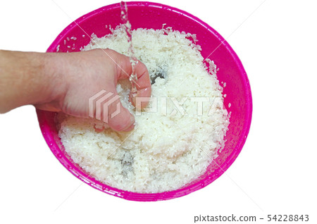 Wash rice with water in the bowl Wash rice with water in the bowl 54228843