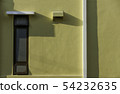window and shadow on yellow wall 54232635