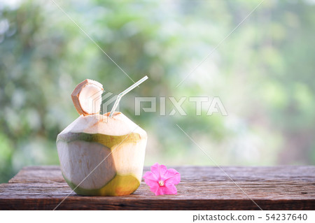 Coconut juice on wooden table at outdoor Coconut juice on wooden table at outdoor 54237640