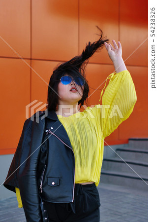 Stylish Pan-Asian girl posing outdoor 54238326