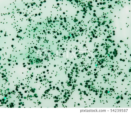Transparent sparkle green paint stain isolated Transparent sparkle green paint stain isolated 54239587
