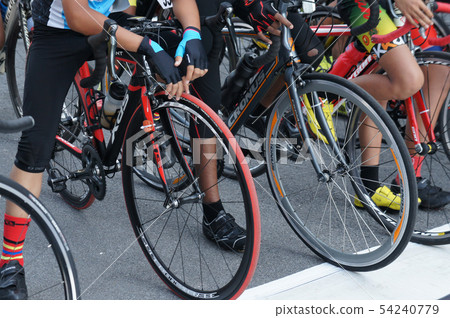 A group of boys with their racing bike. A group of boys with their racing bike. 54240779