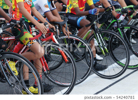 A group of boys with their racing bike. A group of boys with their racing bike. 54240781