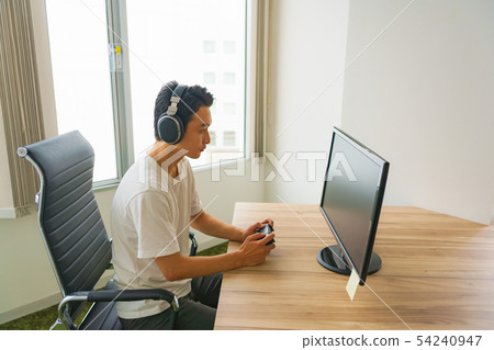 [e sports image] Practice of online competition game in front of monitor or game development engineer 54240947