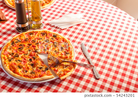Pizza with ham and mushrooms. Delicious hot food sliced and served on white platter. Menu photo Pizza with ham and mushrooms. Delicious hot food sliced and served on white platter. Menu photo 54243201